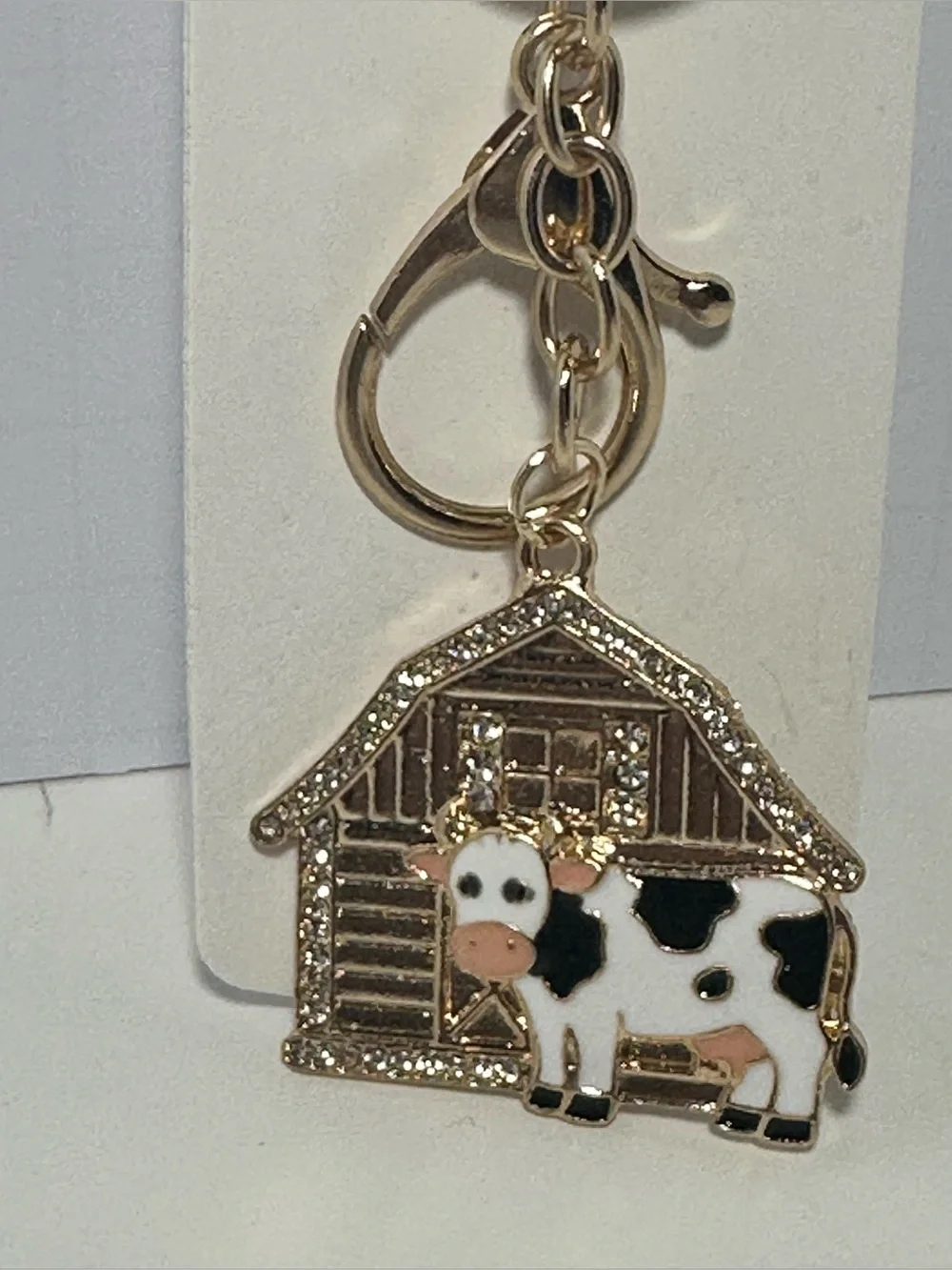 Gold-tone Cow Keychain Charm with Barn Accent